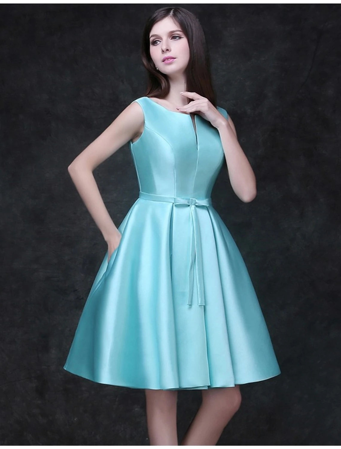 Back view of the A-line satin cocktail dress, showing a ribbon bow detail.