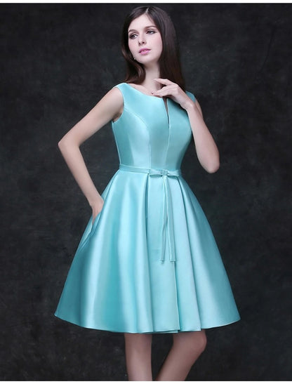 Back view of the A-line satin cocktail dress, showing a ribbon bow detail.