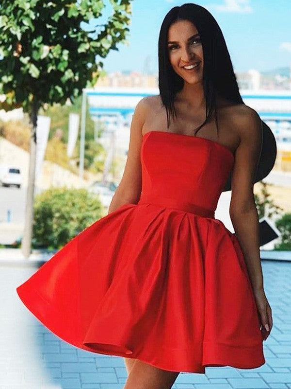 Satin A-line strapless short homecoming dress with ruffles.