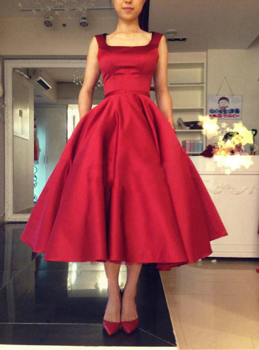Vestidos de fiesta sexys con tirantes y espalda abierta de satén con lazo y largo hasta la rodilla 
