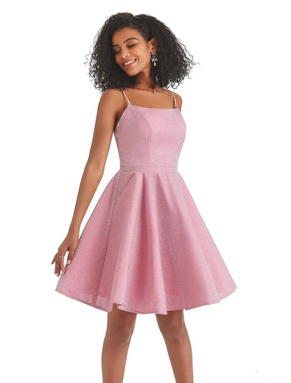 Back view of pink sequin A-line dress with spaghetti straps.