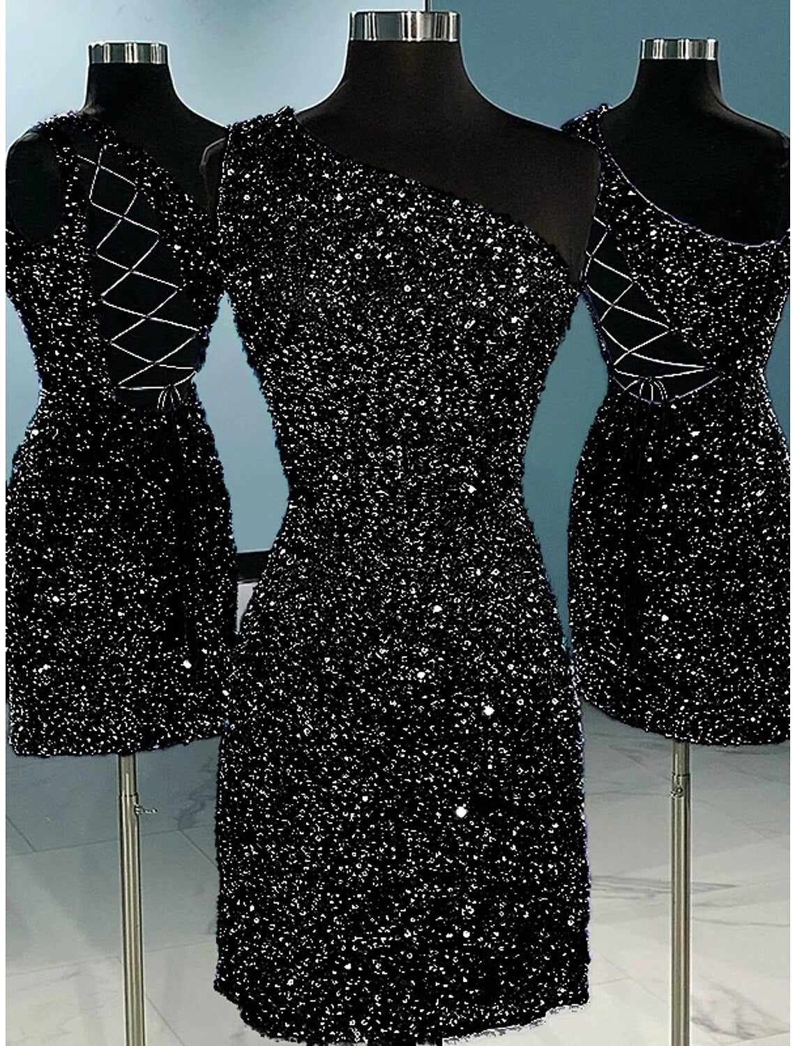 Close-up of the sequined fabric and one-shoulder strap.