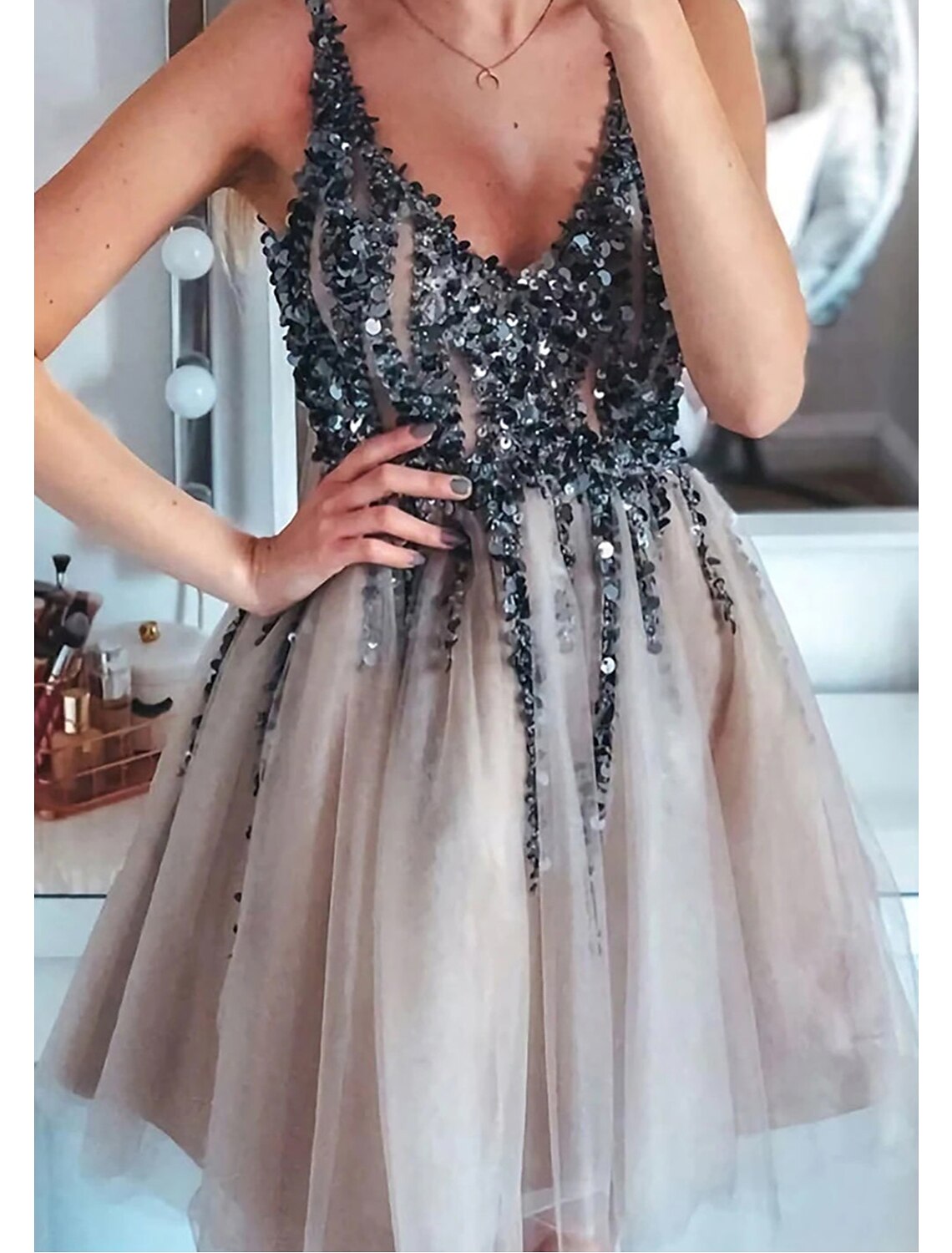 Back view of a glittering A-line short party dress.