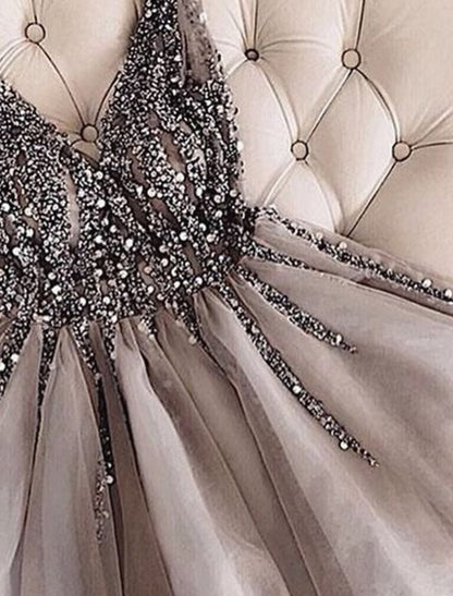 Side profile of a sleeveless V-neck mini dress with sparkle.