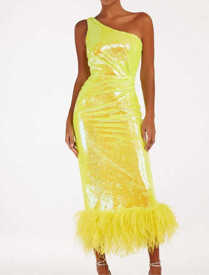 Close-up of the sequined fabric and feather detail on the one-shoulder tea-length dress.