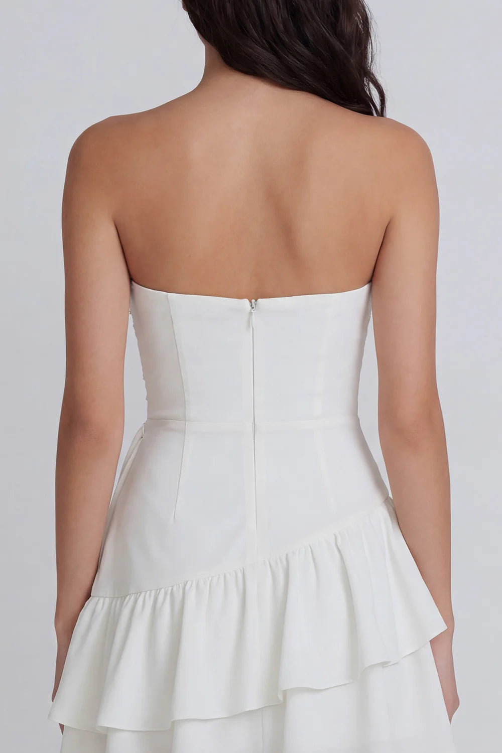 Strapless White Homecoming Dress with Ruched Bodice, Asymmetrical Tiered Ruffle Skirt and Draped Sash Detail