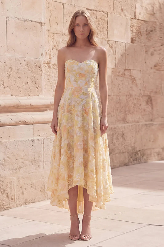 Strapless yellow floral high low prom dress with sweetheart neckline textured fabric and A-line silhouette