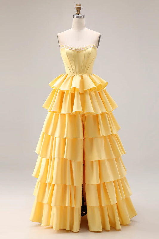 Strapless yellow satin prom dress with beaded neckline corset bodice tiered ruffle skirt and lace-up back