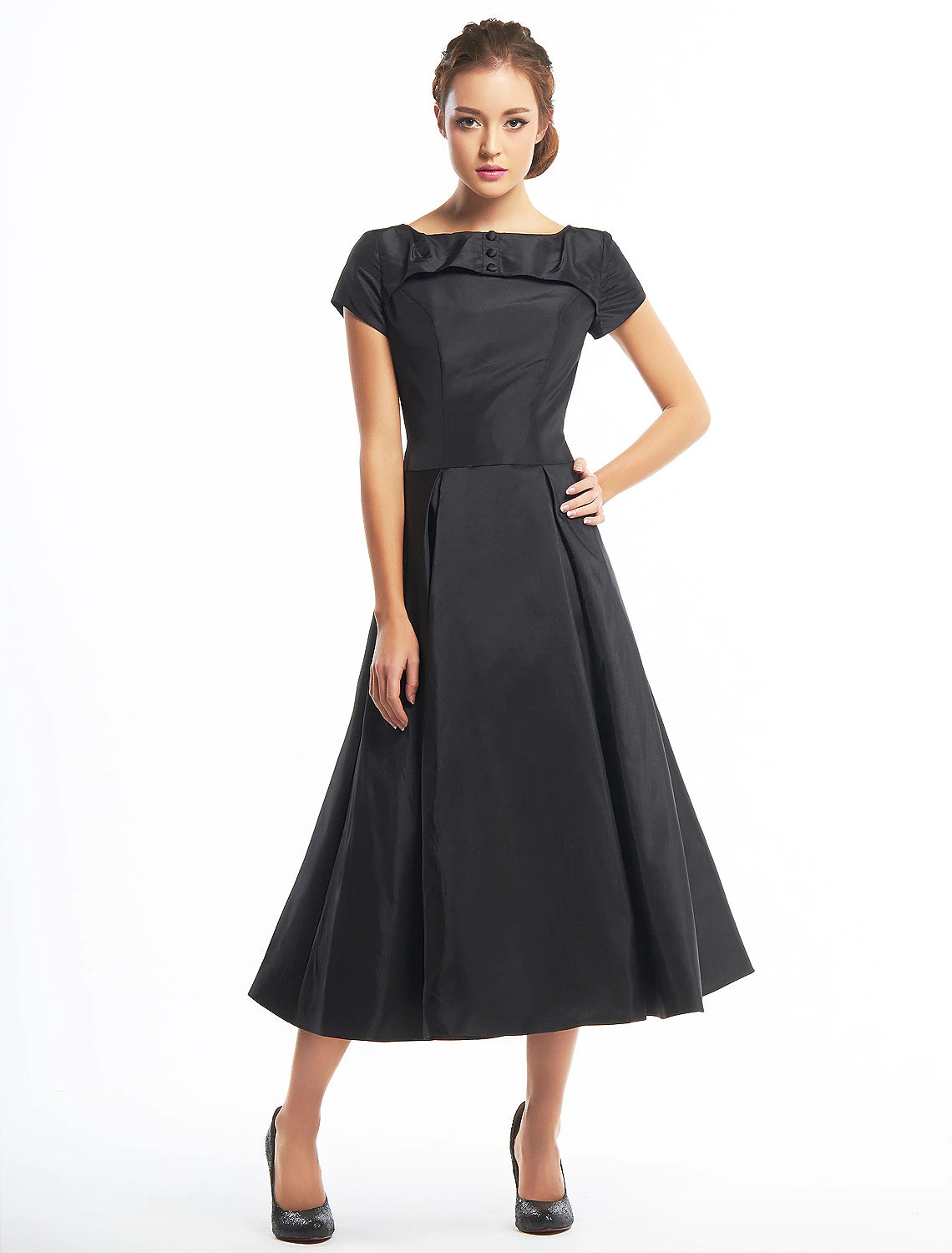 Vintage A-line tea length homecoming dress with short sleeves and boat neck.