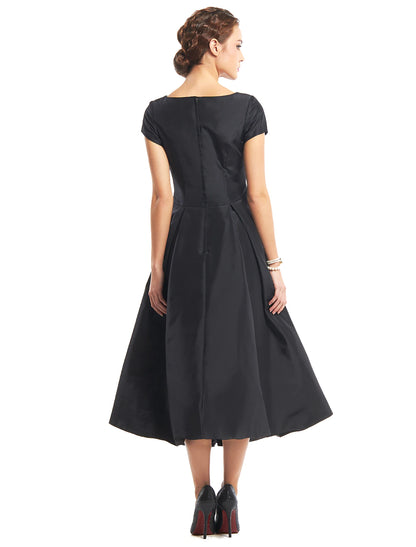 Side profile of the vintage A-line tea length dress.