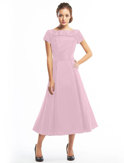 Full view of the vintage A-line dress, showcasing its tea length.