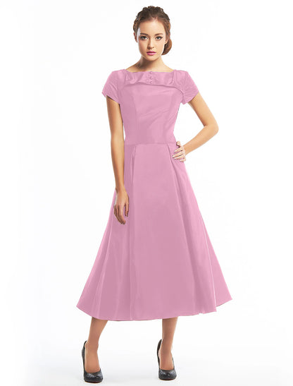Model in the vintage A-line homecoming dress, captured in motion.