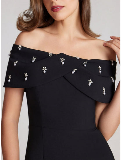 Vestido elegante de fiesta para invitadas de boda, con corte en forma de tubo o columna, largo hasta la rodilla, color negro, manga corta, hombros descubiertos, tejido elástico con cristales.