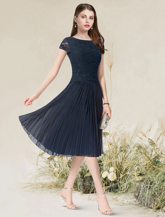 Elegant A-line chiffon cocktail dress with short sleeves and a jewel neck.