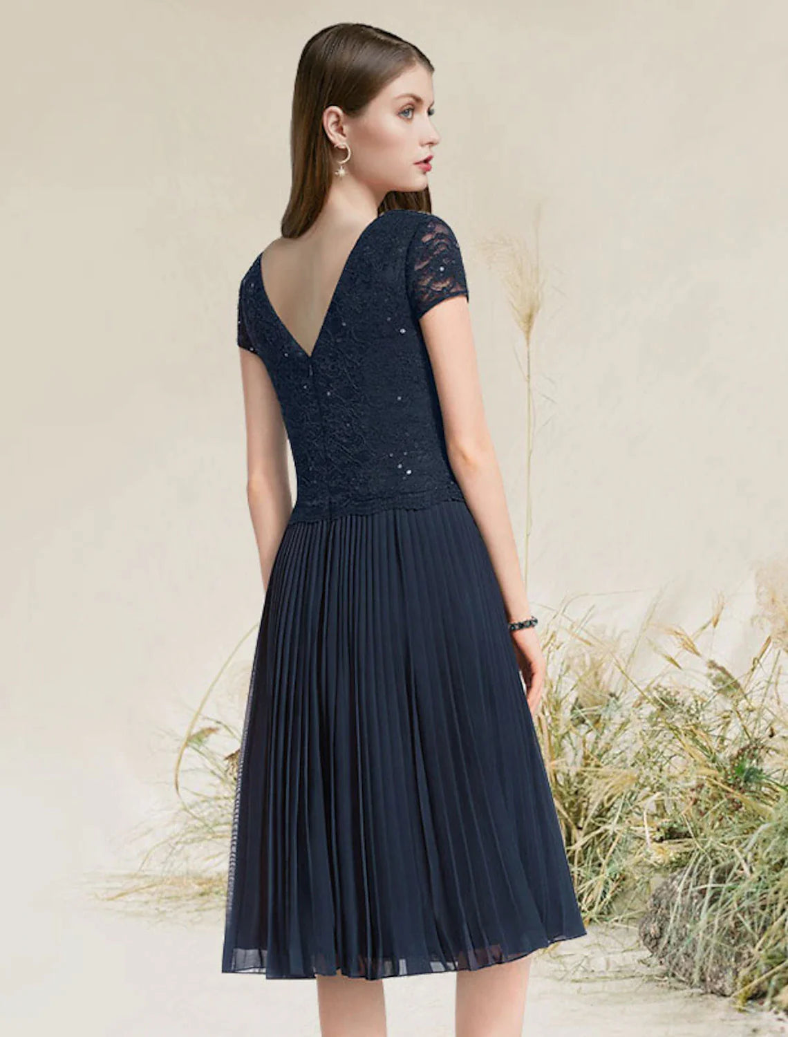 Back view of a chiffon homecoming dress showing the A-line silhouette.