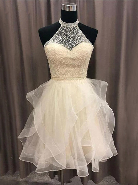 Front view of an A-Line organza short homecoming dress with halter neckline and beading.