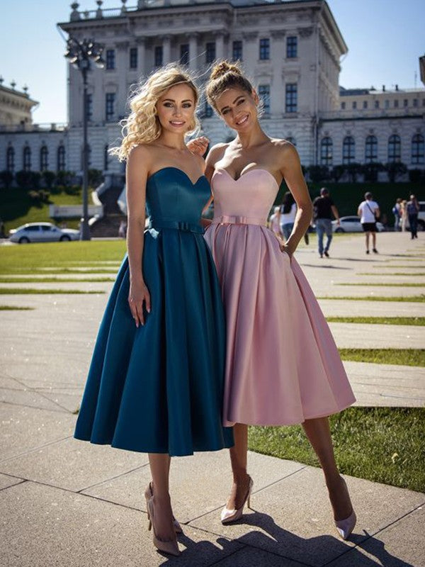 Elegant A-Line satin homecoming dress with sweetheart neckline and bowknot detail.