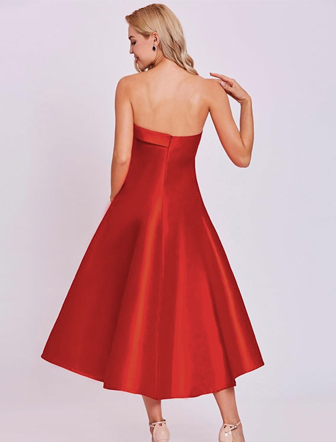 Side profile of the strapless A-line dress, highlighting the tea length.
