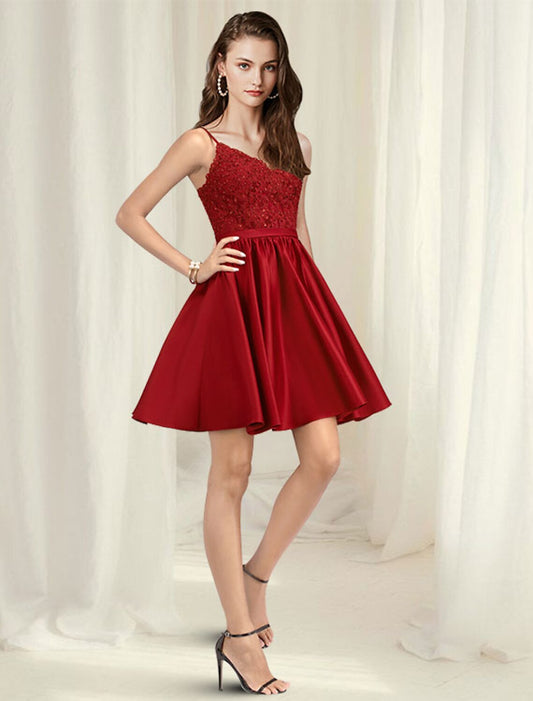 Model wearing a short A-line satin cocktail dress with V-neck and pleats, front view.