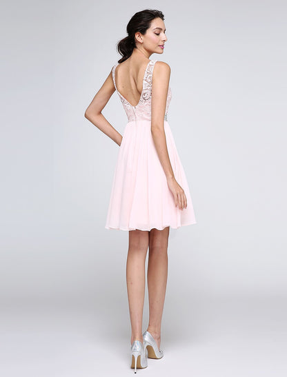 Back view of A-Line dress showing V-back and crystal embellishments.