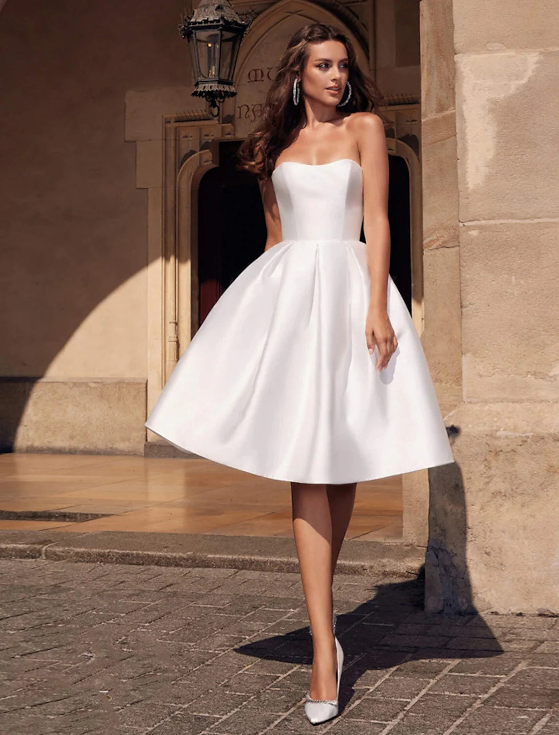 Close-up of the stretch fabric on an A-line strapless dress.