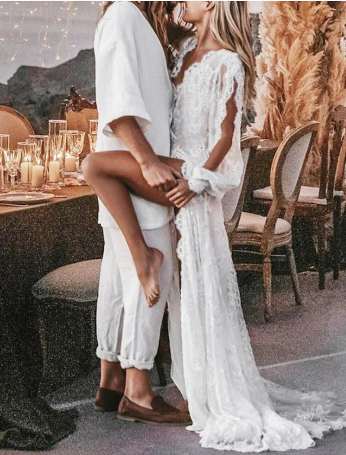 Model gracefully walking in the split front Boho wedding dress, showing its flow.
