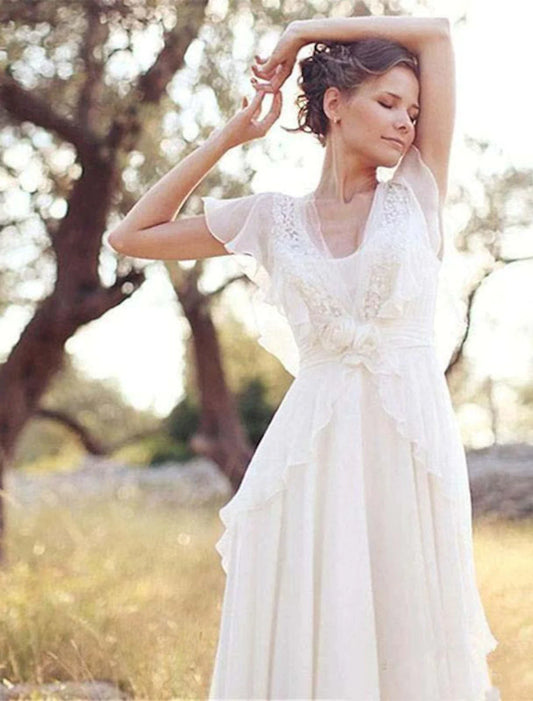 Boho A-line V-neck short sleeve chiffon wedding dress with beading and appliques.