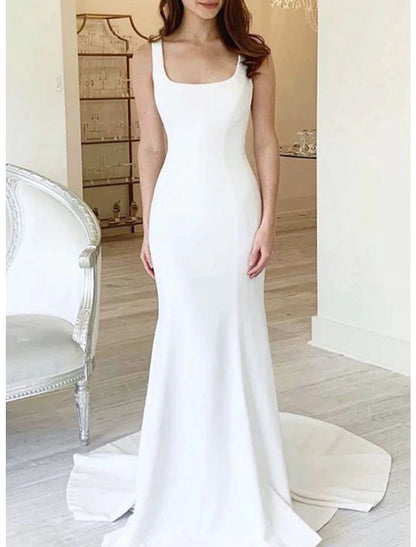 Close-up of the camisole neckline and fabric texture on the white mermaid wedding dress.