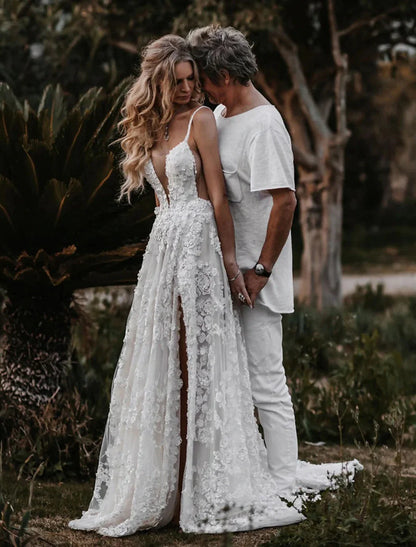 Close-up of delicate lace appliques on a sweetheart neckline wedding dress.