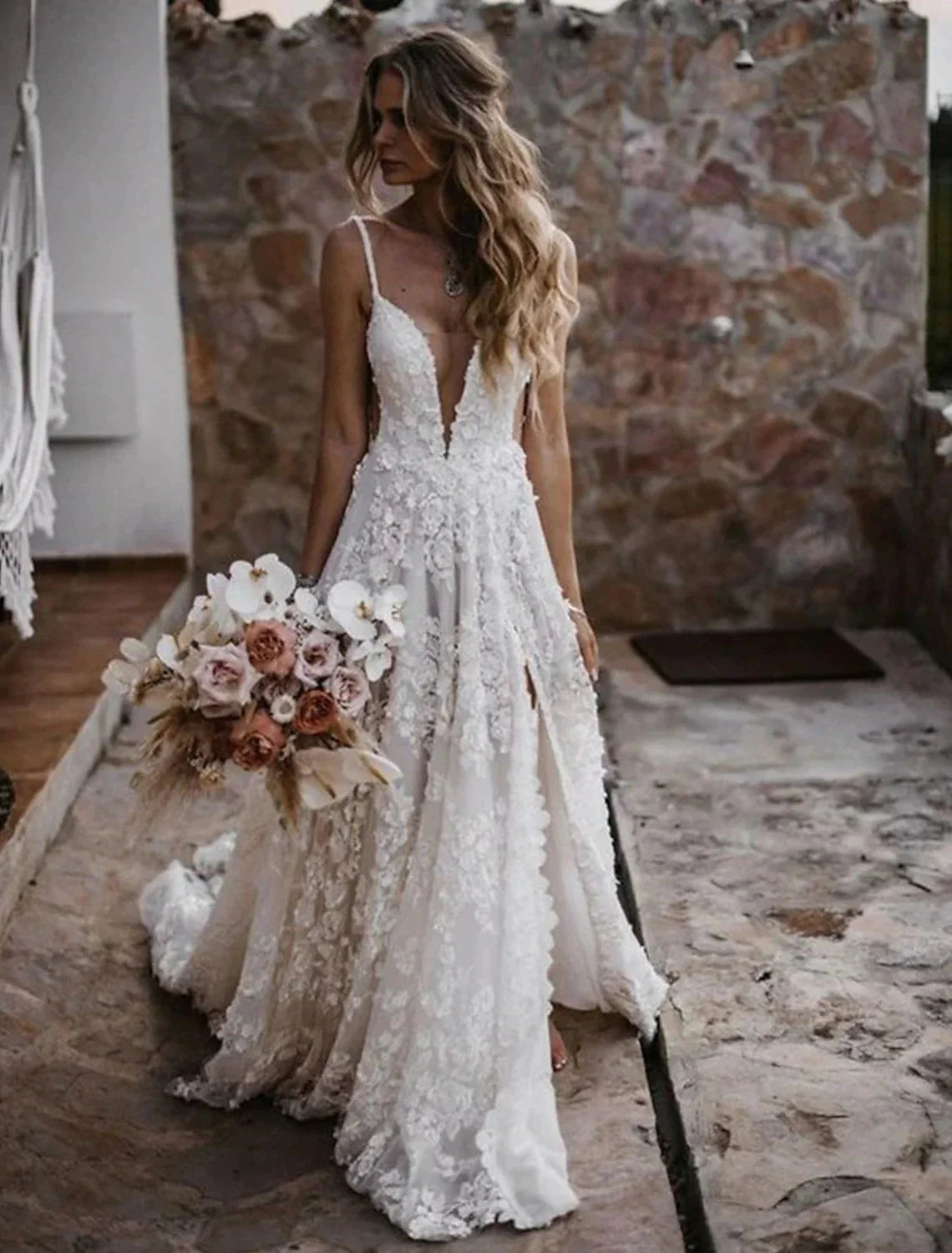 Boho bridal gown featuring a stylish split front for ease of movement.