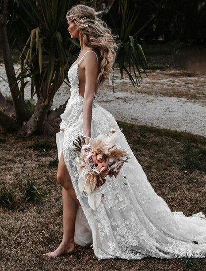 Side profile of A-line wedding dress with flowing skirt and spaghetti straps.
