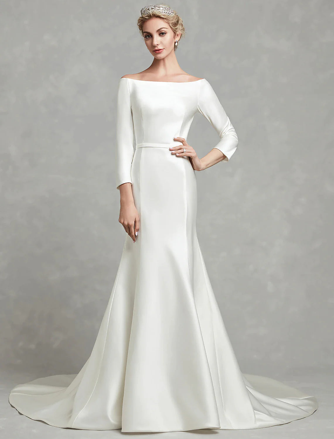 Back view of a pleated satin mermaid bridal gown.
