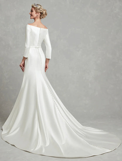 Side profile of an elegant off-shoulder wedding dress.