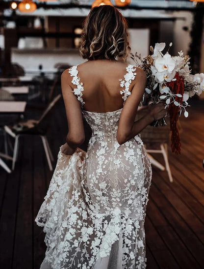 Bride posing in a mermaid trumpet wedding dress, showing the full silhouette.
