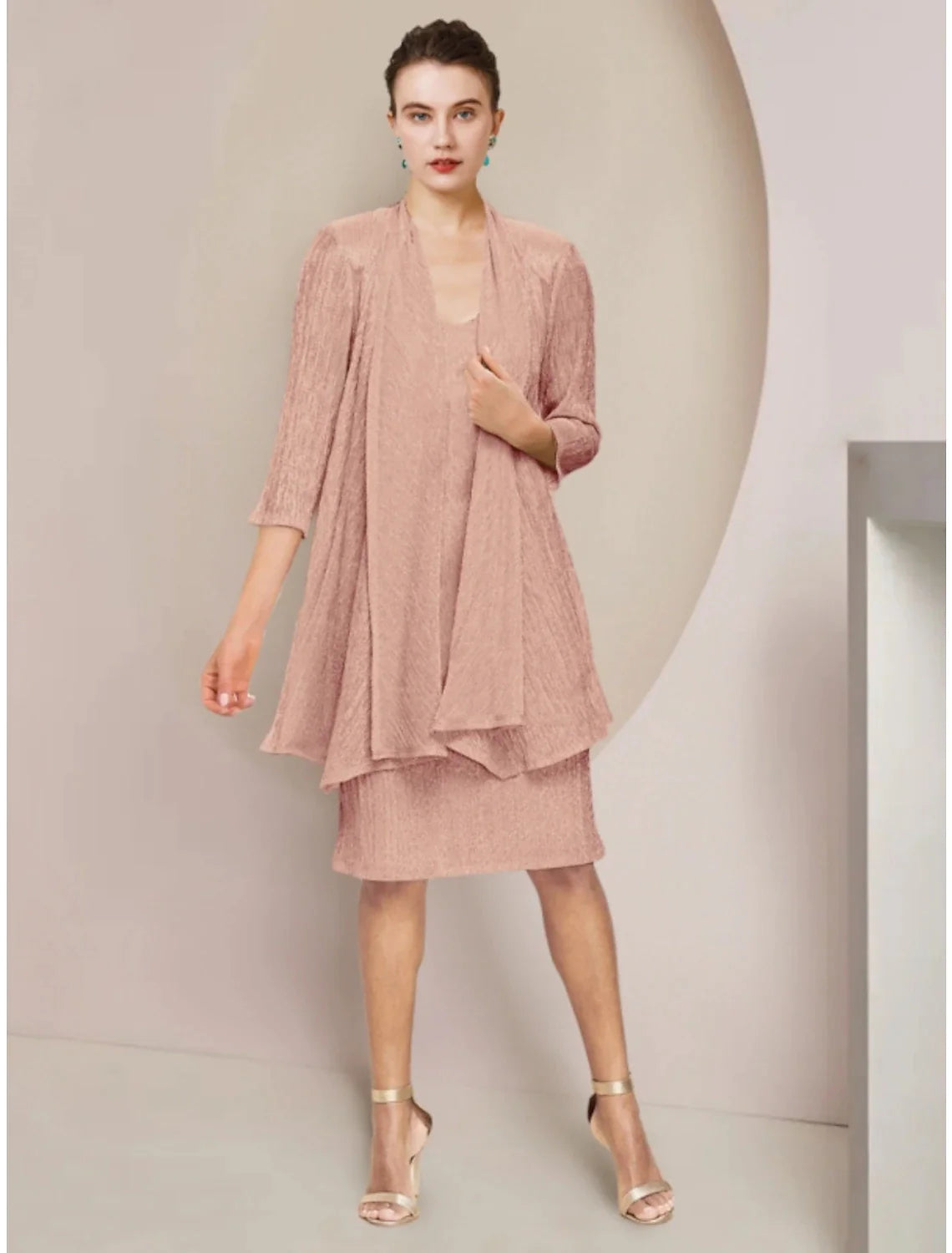 Petite two-piece mother of the bride dress with scoop neck, lace 3/4 sleeves, and pleated knee-length skirt.