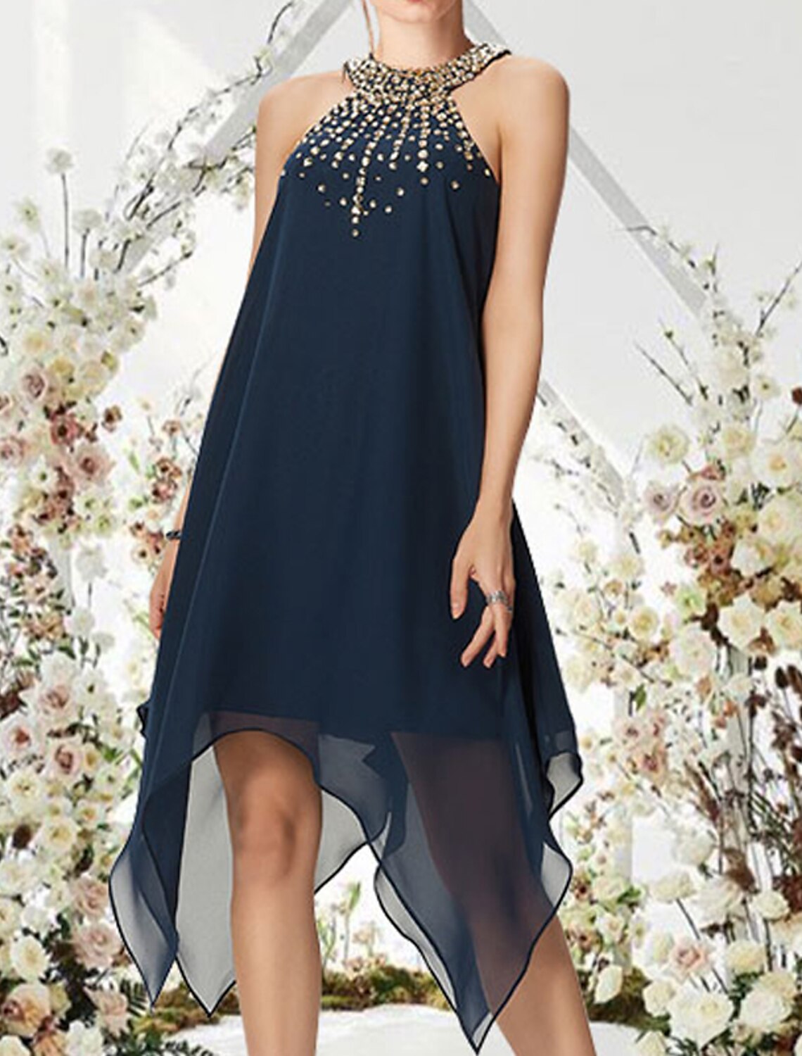 Back view of the A-line halter cocktail dress, highlighting the flowing chiffon and crystal embellishments.
