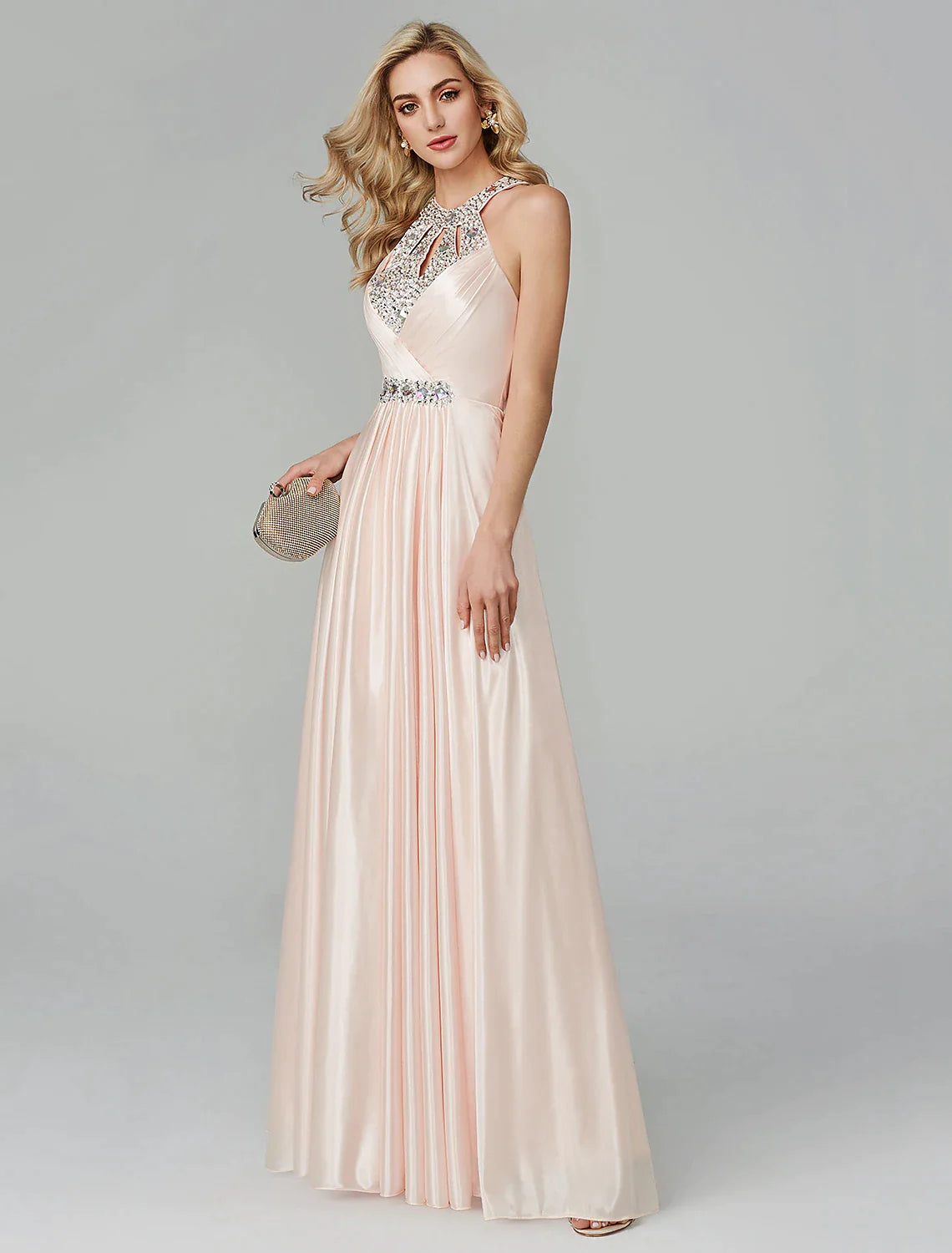 Rear view of the black gown, emphasizing the halter neckline and open back.