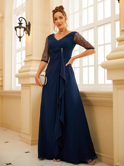 Light blue A-line chiffon evening gown with V-neck and half sleeves.