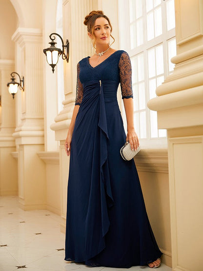 Back view of a light blue ruched chiffon A-line gown.