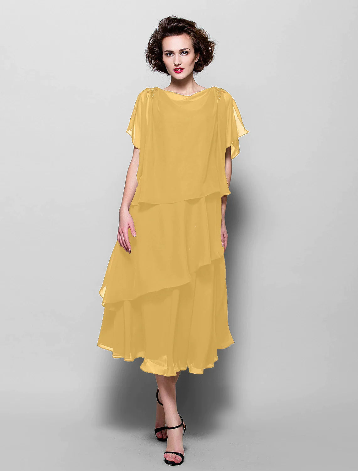 Plus size chiffon tea-length dress with delicate ruffles.