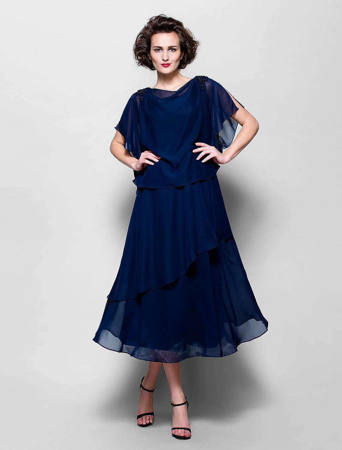 Side view of the elegant short sleeve Mother of the Bride gown.