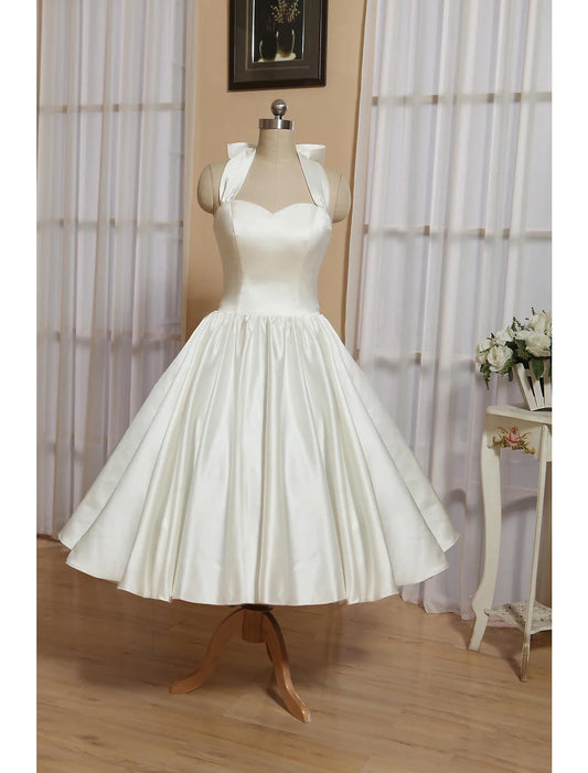 Elegant A-line halter little white wedding dress with bows and pleats.