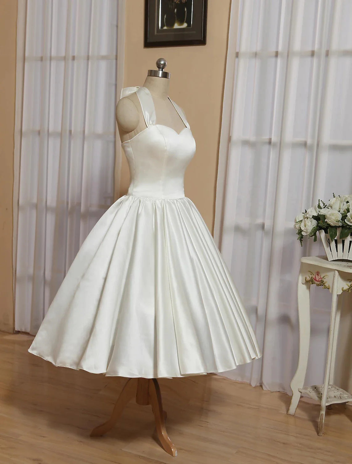 Back view of the A-line halter little white wedding dress, showing pleats.