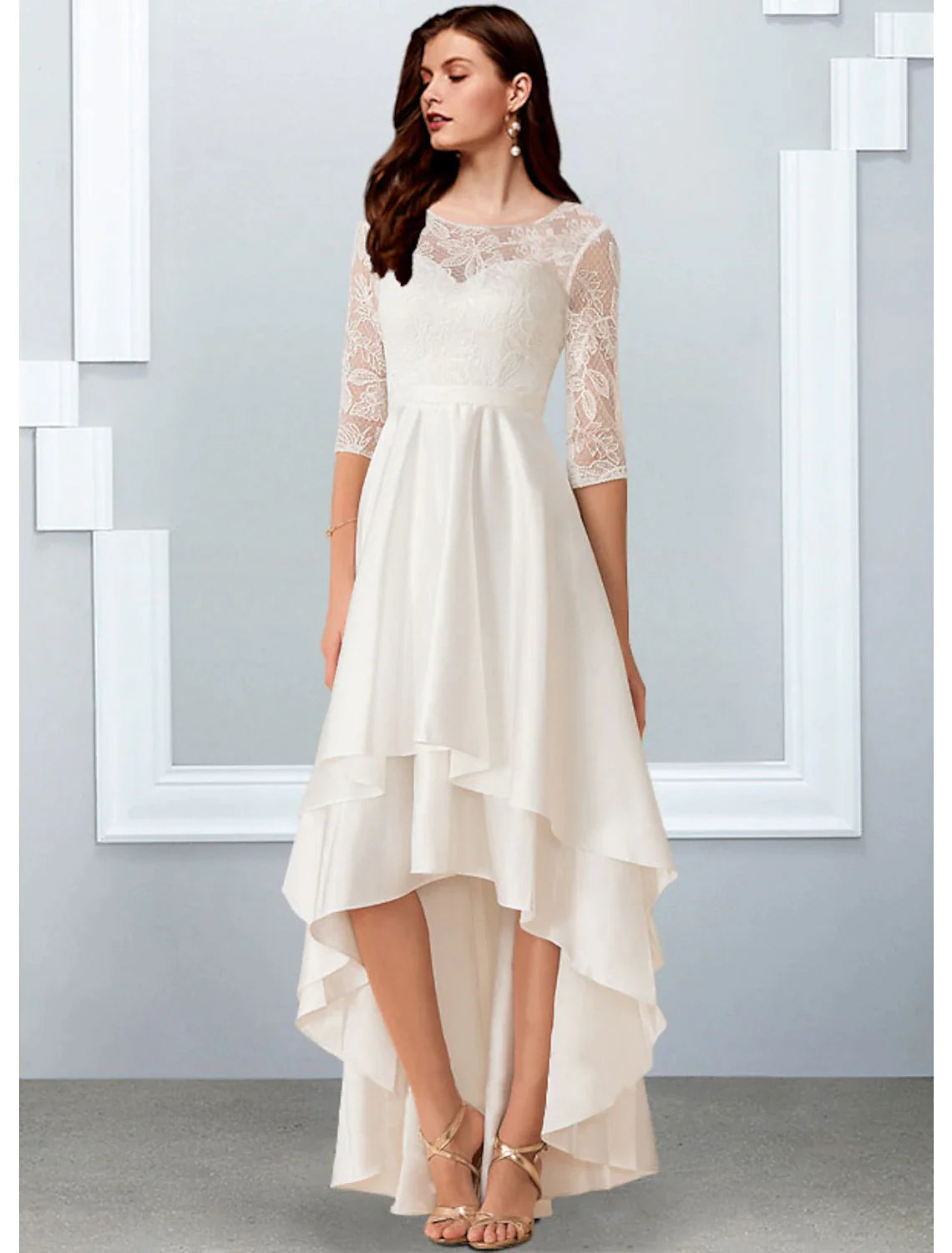 Model wearing an elegant A-line little white reception wedding dress with illusion neck and half sleeves.