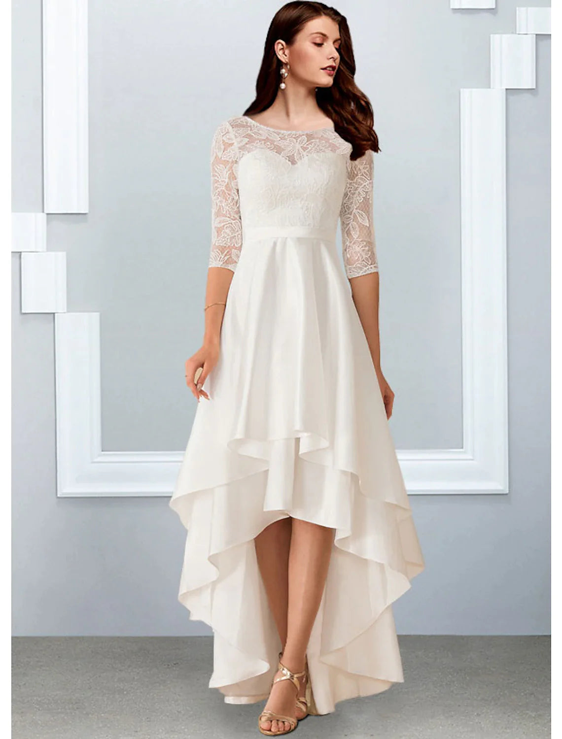 Back view of the little white wedding dress, showing the illusion back and half sleeves.