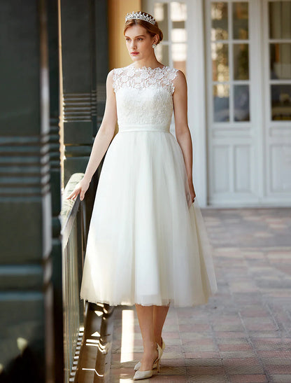 Model posing in the A-Line white wedding reception dress.