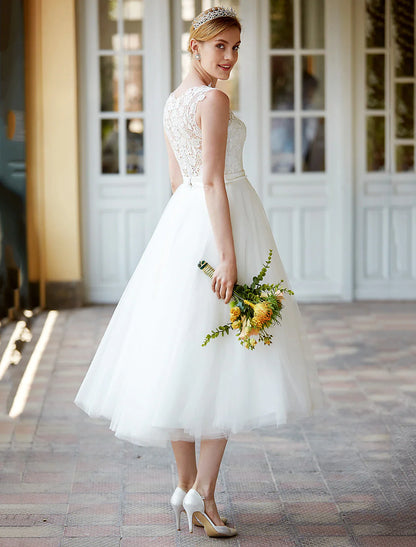 Front view of the sleeveless lace white reception dress.