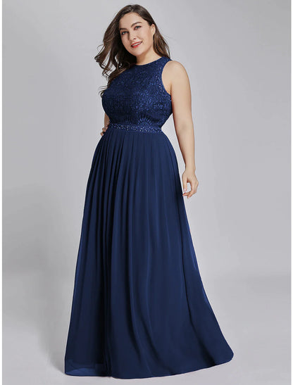 Full length view of a woman in a light blue chiffon wedding guest dress.