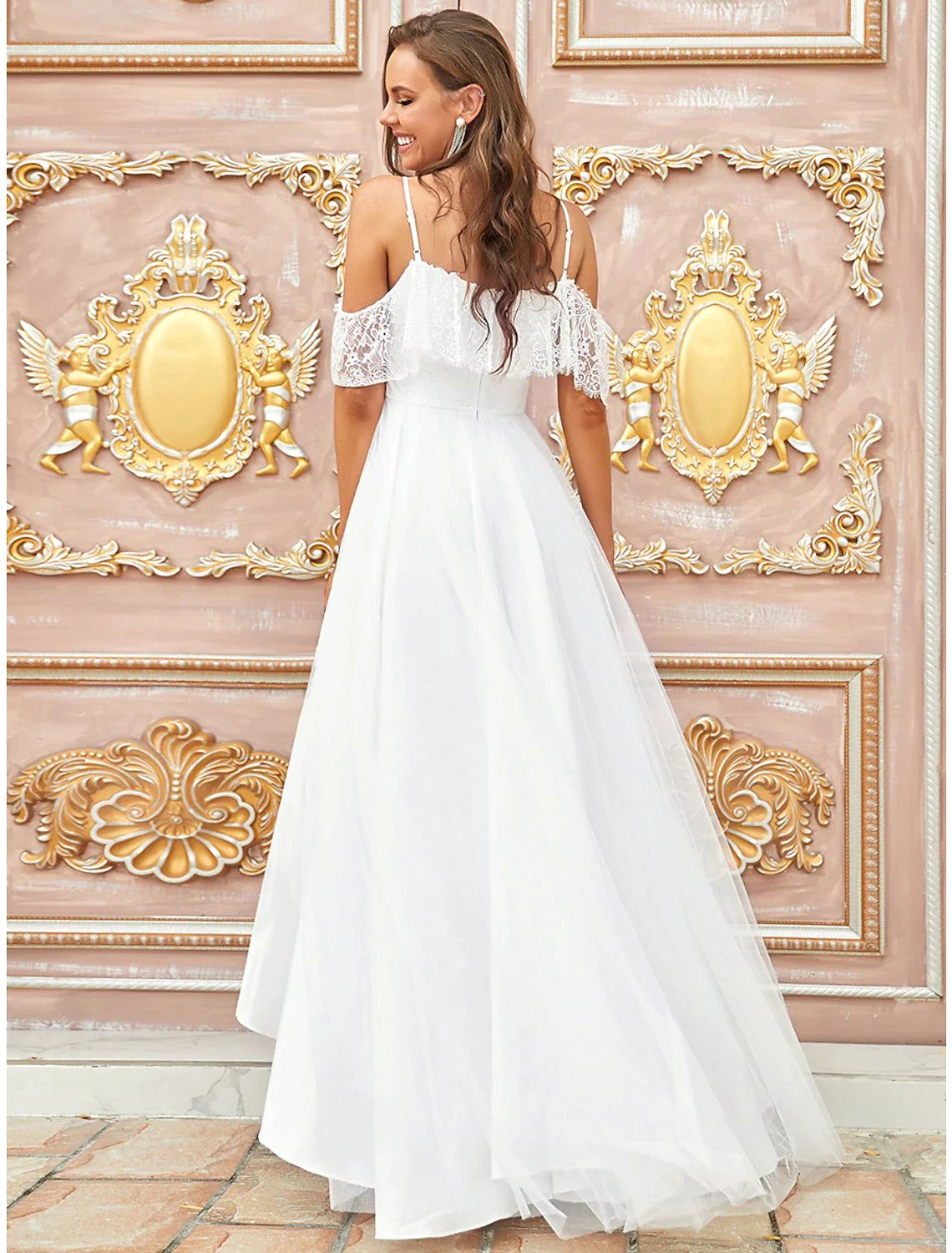 Side view of a boho A-Line off-shoulder lace bridal gown.