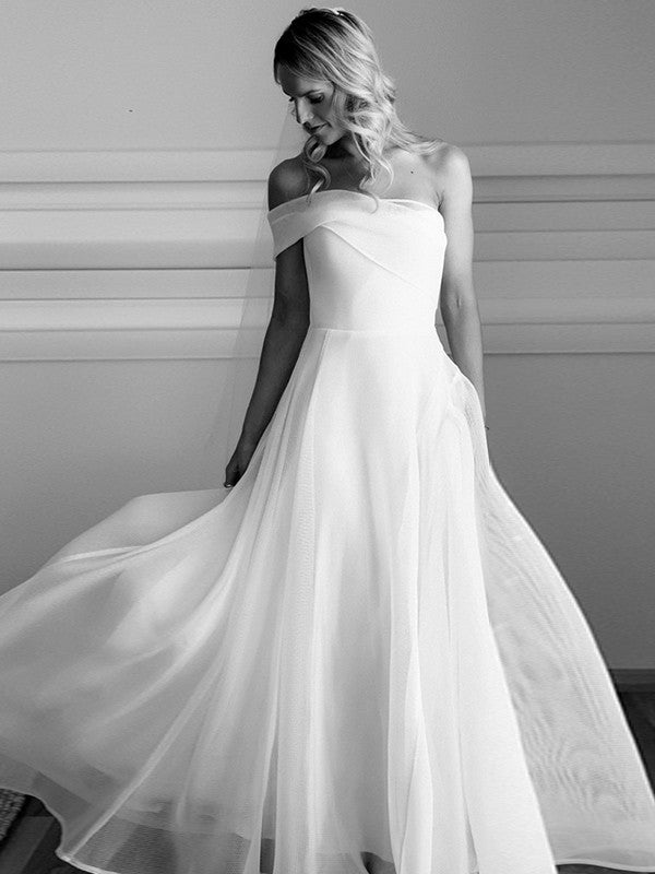 Back view of the A-Line organza wedding dress, showcasing the elegant court train and ruched detailing.
